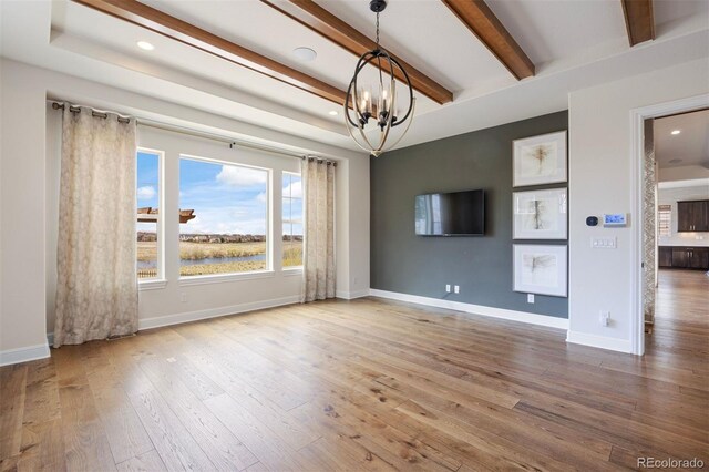 27381 E Lakeview Dr, Aurora, CO 80016 - unfurnished room with a chandelier, wood finished floors, baseboards, beam ceiling, and recessed lighting