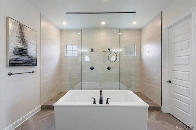 27381 E Lakeview Dr, Aurora, CO 80016 - full bath featuring tiled shower, a soaking tub, tile patterned flooring, and baseboards