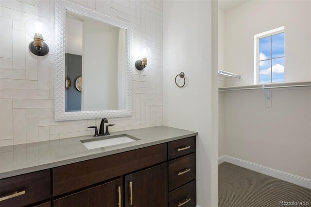 27381 E Lakeview Dr, Aurora, CO 80016 - bathroom with vanity and baseboards