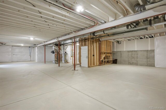 27381 E Lakeview Dr, Aurora, CO 80016 - unfinished basement featuring gas water heater and heating unit