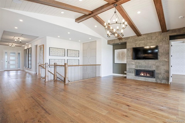 27381 E Lakeview Dr, Aurora, CO 80016 - unfurnished living room featuring wood finished floors, a chandelier, a tile fireplace, and recessed lighting
