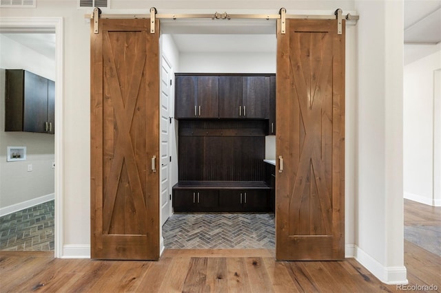 27381 E Lakeview Dr, Aurora, CO 80016 - detailed view of a barn door and wood finished floors