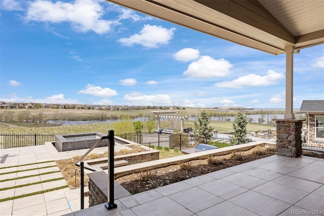 27381 E Lakeview Dr, Aurora, CO 80016 - view of patio / terrace with a water view and a fire pit