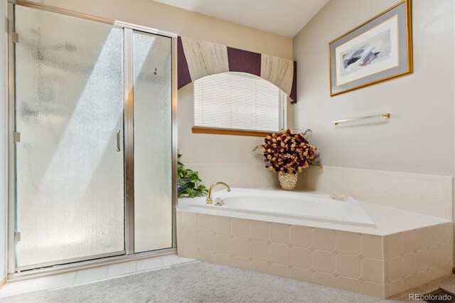 5134 S Ouray Ct, Centennial, CO 80015 - bathroom featuring a shower stall, a bath, and tile patterned floors