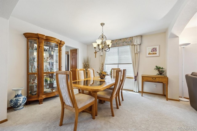 5134 S Ouray Ct, Centennial, CO 80015 - dining space featuring light colored carpet, a chandelier, and baseboards