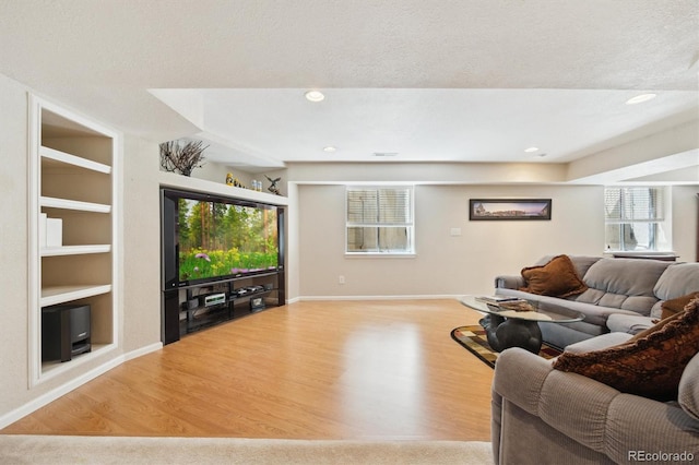 5134 S Ouray Ct, Centennial, CO 80015 - living area featuring wood finished floors, plenty of natural light, built in shelves, baseboards, and recessed lighting
