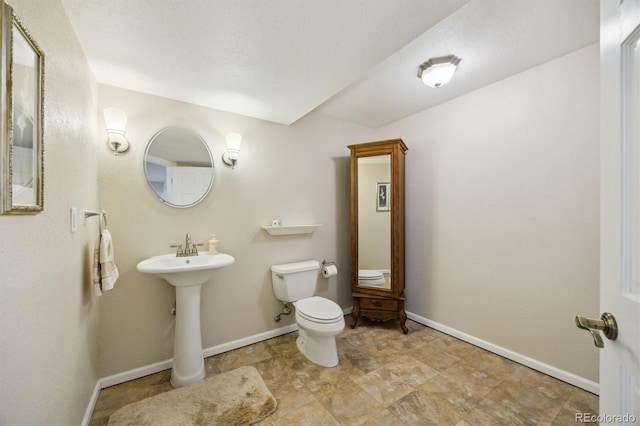 5134 S Ouray Ct, Centennial, CO 80015 - half bathroom with baseboards, toilet, and a sink