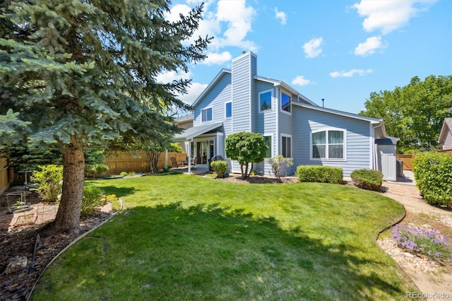 5134 S Ouray Ct, Centennial, CO 80015 - rear view of house featuring a chimney