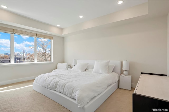 bedroom featuring light colored carpet