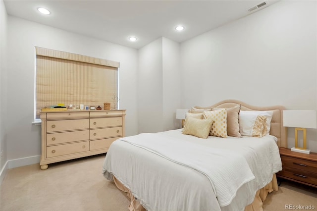 bedroom featuring light colored carpet