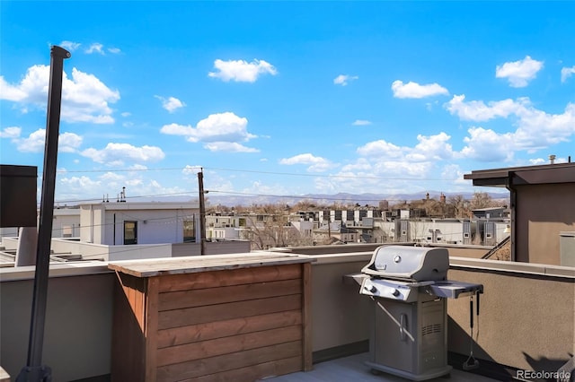 view of patio featuring grilling area and a balcony