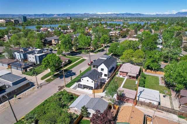 drone / aerial view featuring a water and mountain view