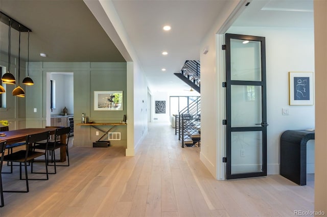 hall featuring light hardwood / wood-style flooring