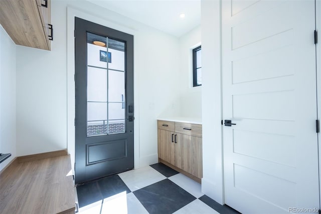 doorway to outside featuring plenty of natural light