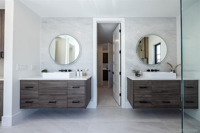 bathroom featuring tile flooring and tile walls