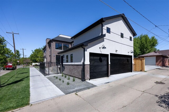 view of front facade featuring a front yard and a garage