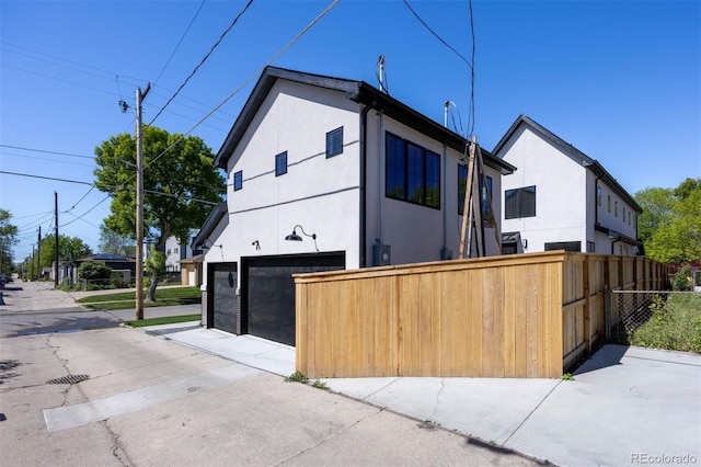 view of side of property featuring a garage