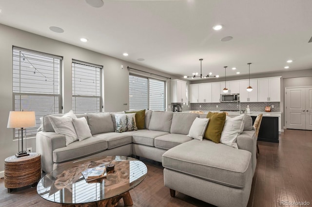 5841 Alton St, Denver, CO 80238 - living area featuring a chandelier, recessed lighting, and dark wood-style flooring