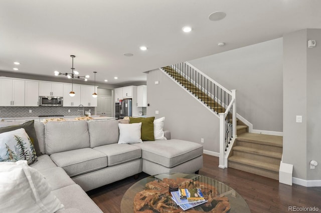 5841 Alton St, Denver, CO 80238 - living room with stairway, a chandelier, recessed lighting, and dark wood finished floors