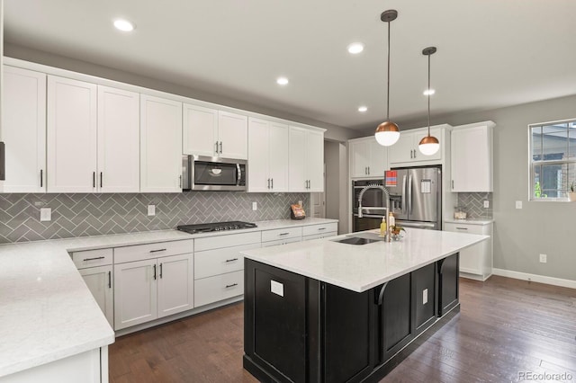 5841 Alton St, Denver, CO 80238 - kitchen featuring stainless steel appliances, dark wood-style flooring, white cabinetry, and recessed lighting