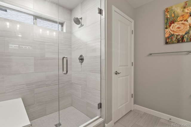 5841 Alton St, Denver, CO 80238 - full bathroom featuring a stall shower and baseboards