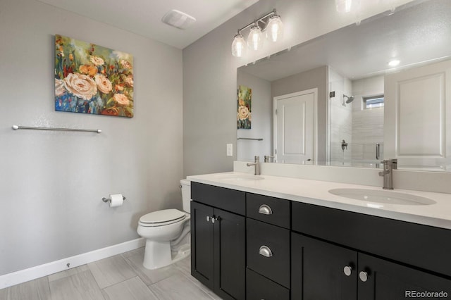 5841 Alton St, Denver, CO 80238 - bathroom featuring double vanity and a tile shower