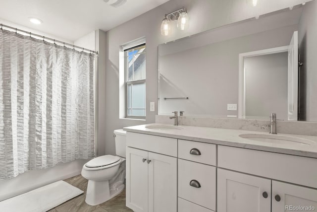 5841 Alton St, Denver, CO 80238 - bathroom with double vanity and shower / bath combo