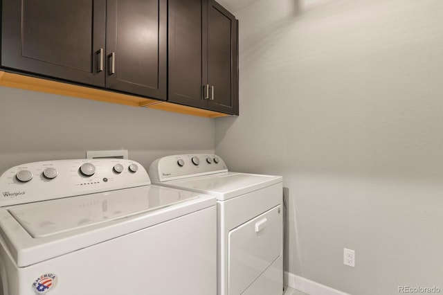 5841 Alton St, Denver, CO 80238 - laundry room featuring cabinet space and washer and clothes dryer