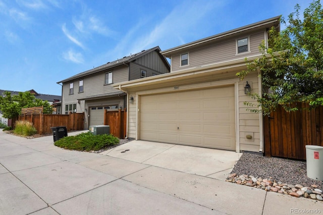 5841 Alton St, Denver, CO 80238 - traditional-style house featuring driveway and an attached garage