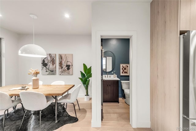 dining area featuring light wood-type flooring