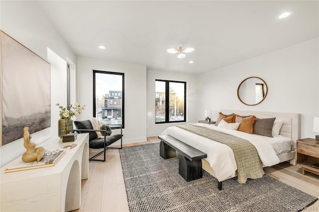 bedroom with hardwood / wood-style floors