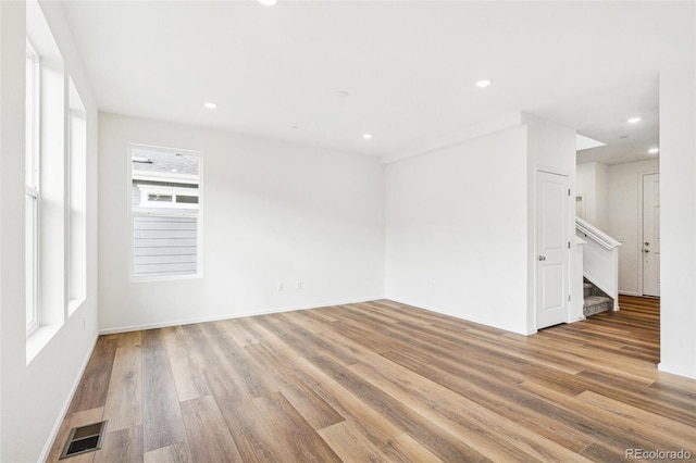 empty room with light wood-type flooring