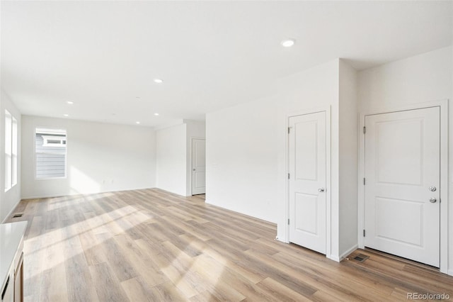 spare room with light hardwood / wood-style floors