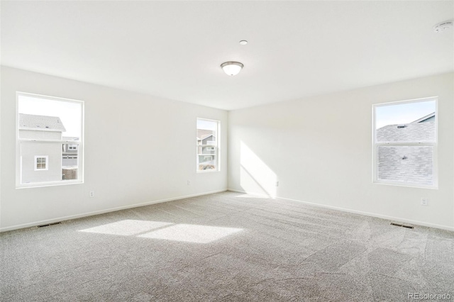 empty room featuring light carpet