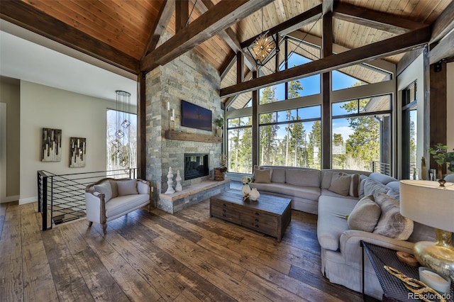 living area with wood-type flooring, high vaulted ceiling, wooden ceiling, beam ceiling, and baseboards