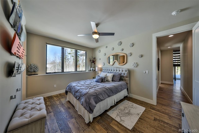 bedroom featuring wood-type flooring, baseboards, multiple windows, and recessed lighting