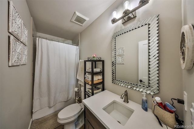 bathroom featuring vanity, toilet, and shower / tub combo with curtain