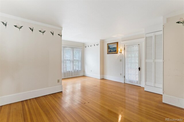 120 E Espanola St, Colorado Springs, CO 80907 - unfurnished room featuring light wood-style floors and crown molding
