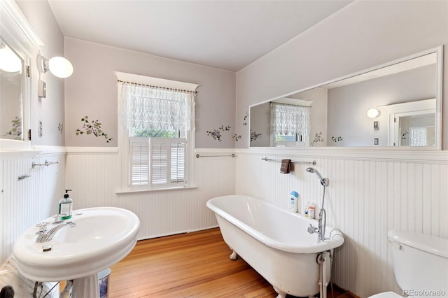 120 E Espanola St, Colorado Springs, CO 80907 - full bathroom with wainscoting, a freestanding bath, and wood finished floors