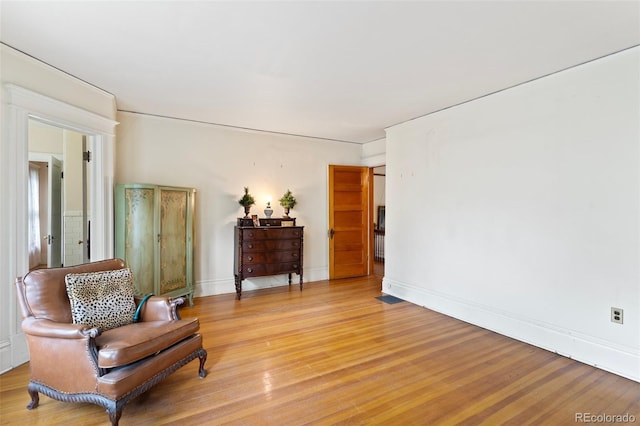 120 E Espanola St, Colorado Springs, CO 80907 - living area featuring light wood-type flooring and baseboards