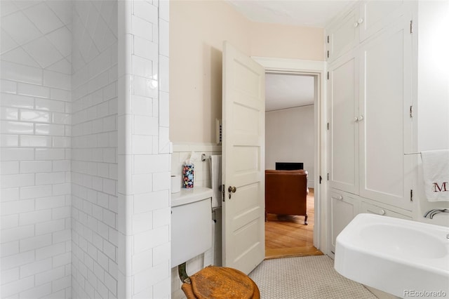 120 E Espanola St, Colorado Springs, CO 80907 - bathroom with a wainscoted wall and tile patterned flooring
