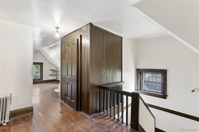 120 E Espanola St, Colorado Springs, CO 80907 - corridor featuring an upstairs landing, radiator, vaulted ceiling, and hardwood / wood-style flooring