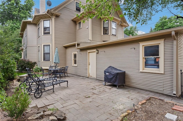 120 E Espanola St, Colorado Springs, CO 80907 - back of house with a patio area and a chimney