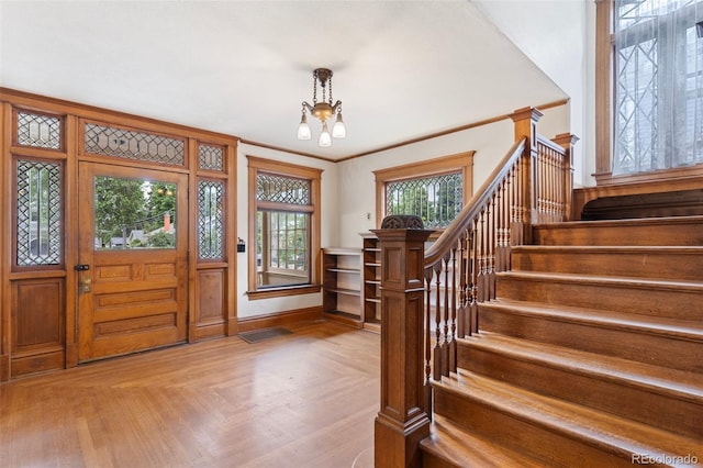 120 E Espanola St, Colorado Springs, CO 80907 - foyer entrance featuring a chandelier and stairway