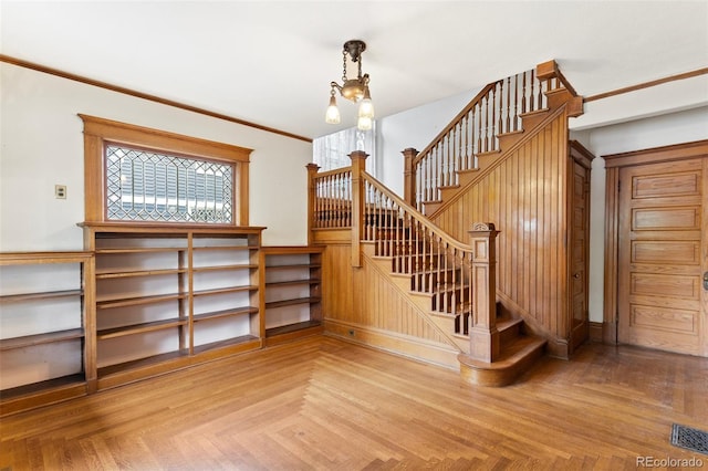 120 E Espanola St, Colorado Springs, CO 80907 - staircase with a chandelier and crown molding