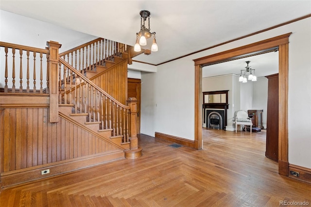 120 E Espanola St, Colorado Springs, CO 80907 - stairway with a chandelier and crown molding