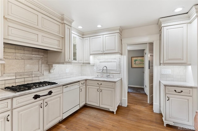 120 E Espanola St, Colorado Springs, CO 80907 - kitchen featuring white dishwasher, stainless steel gas stovetop, tasteful backsplash, recessed lighting, and light wood finished floors