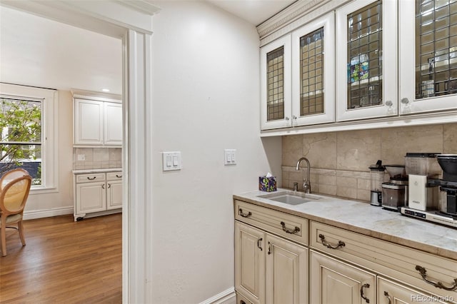 120 E Espanola St, Colorado Springs, CO 80907 - bar featuring backsplash and light wood-style flooring