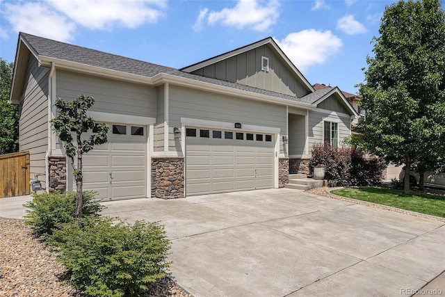 3406 Quicksilver Rd, Frederick, CO 80516 - craftsman-style house featuring an attached garage, board and batten siding, driveway, and stone siding