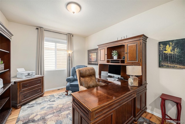 3406 Quicksilver Rd, Frederick, CO 80516 - office featuring light wood-style floors and baseboards
